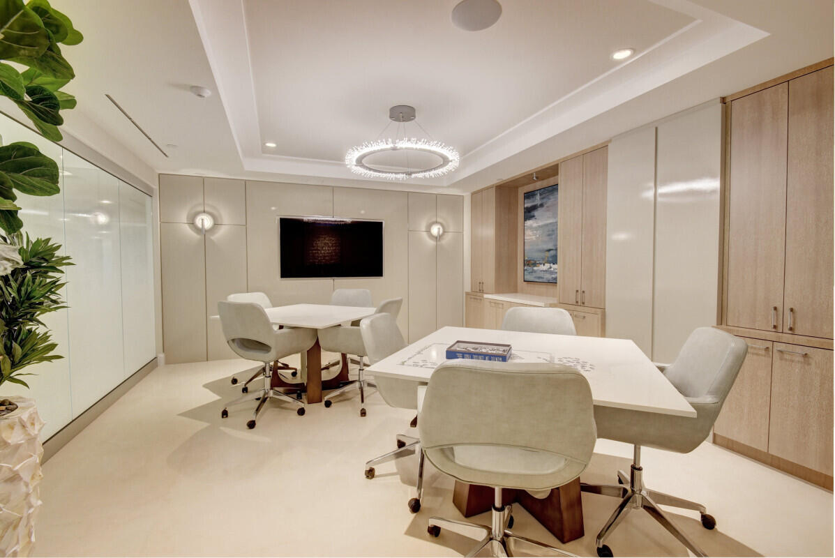 250 South Ocean Boulevard, Unit 11F Boca Raton, FL 33432 - Photo 27 of 45 a view of a livingroom with furniture and a flat screen tv