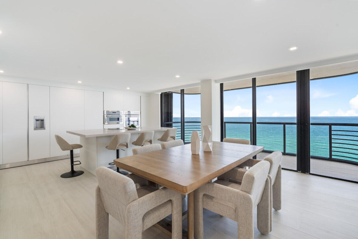 250 South Ocean Boulevard, Unit 11F Boca Raton, FL 33432 - Photo 5 of 45 a view of kitchen and dining area with wooden floor