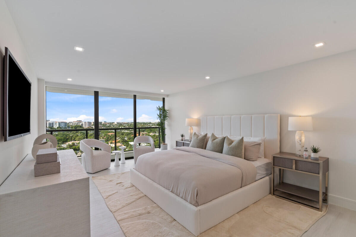 250 South Ocean Boulevard, Unit 11F Boca Raton, FL 33432 - Photo 7 of 45 a bed room with large bed and a large window