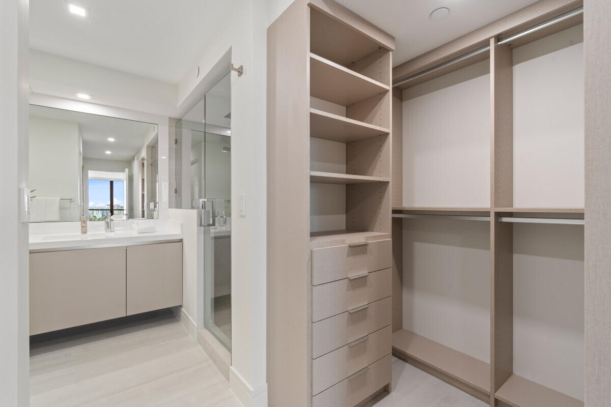 250 South Ocean Boulevard, Unit 11F Boca Raton, FL 33432 - Photo 9 of 45 a bathroom with a shower and a sink