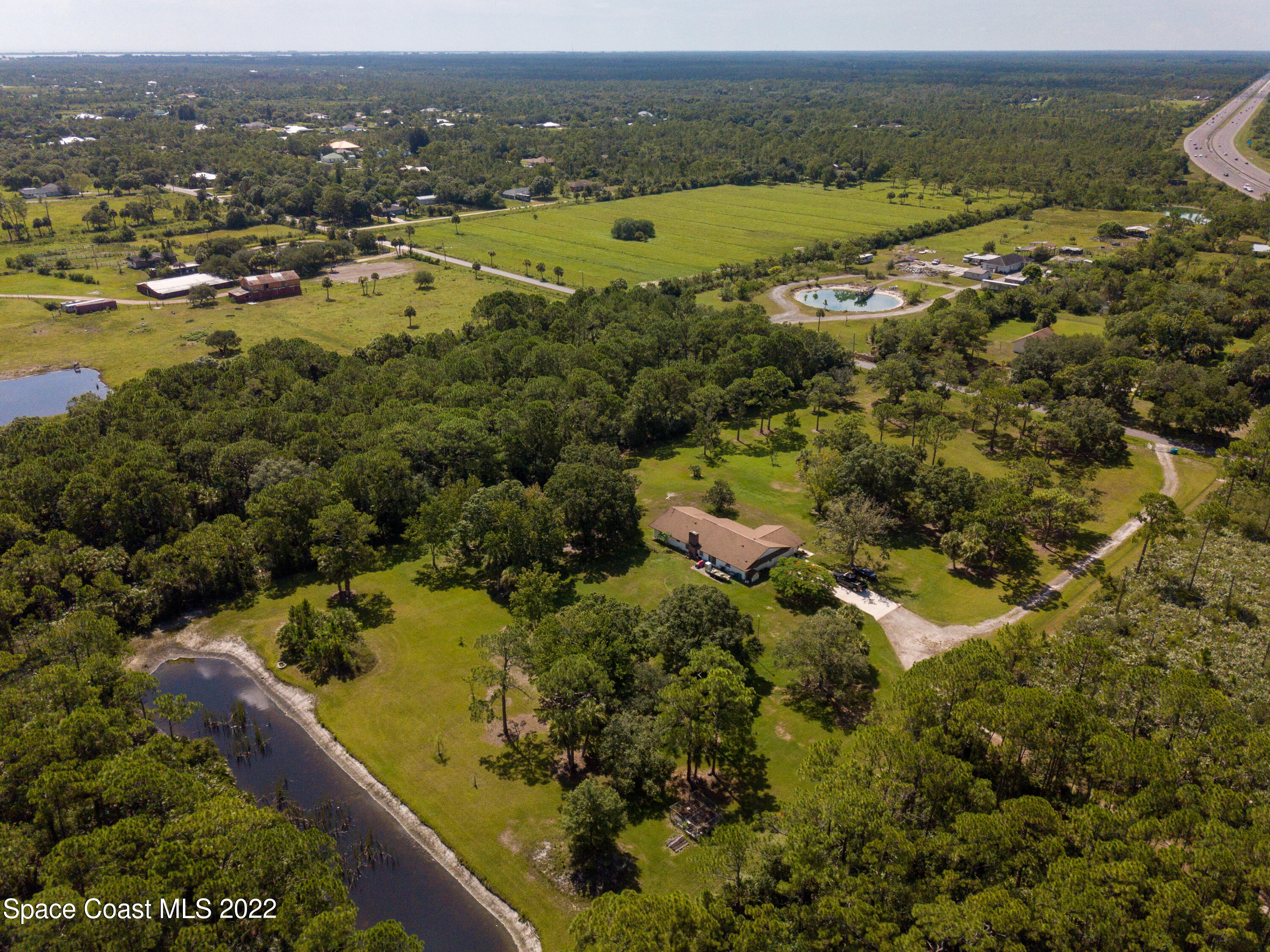 200 Atz Road Malabar, FL 32950 - Photo 16 of 30 an aerial view of residential houses with outdoor space