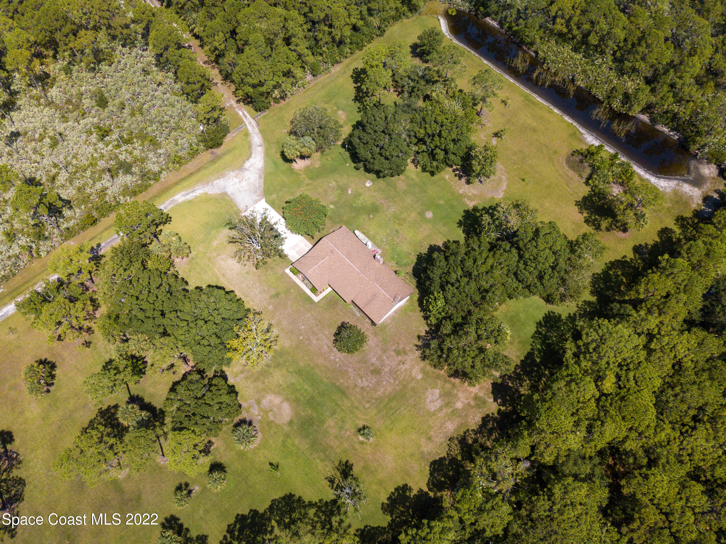 200 Atz Road Malabar, FL 32950 - Photo 17 of 30 a view of swimming pool with a garden
