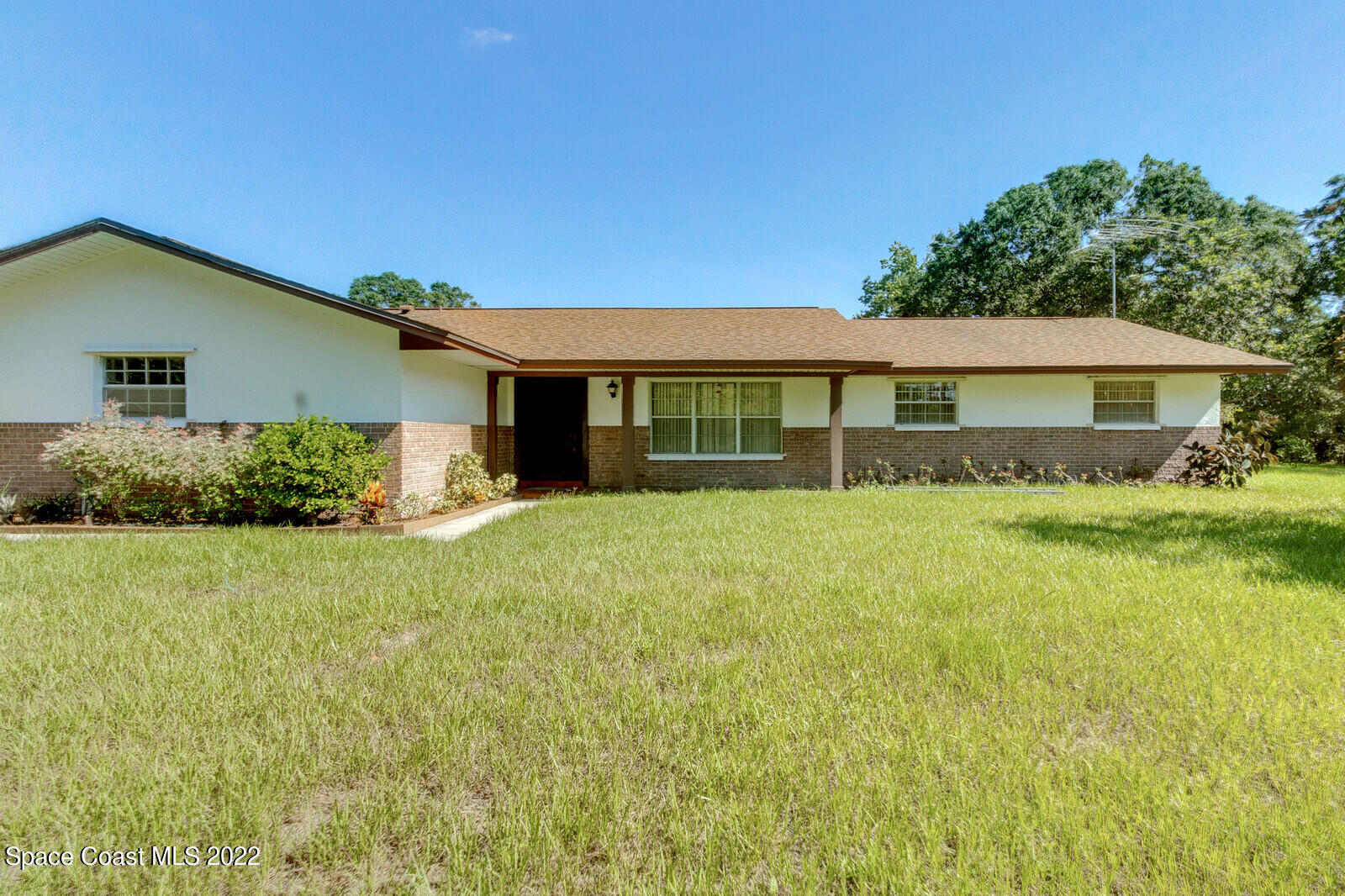 200 Atz Road Malabar, FL 32950 - Photo 2 of 30 a front view of house with yard and green space