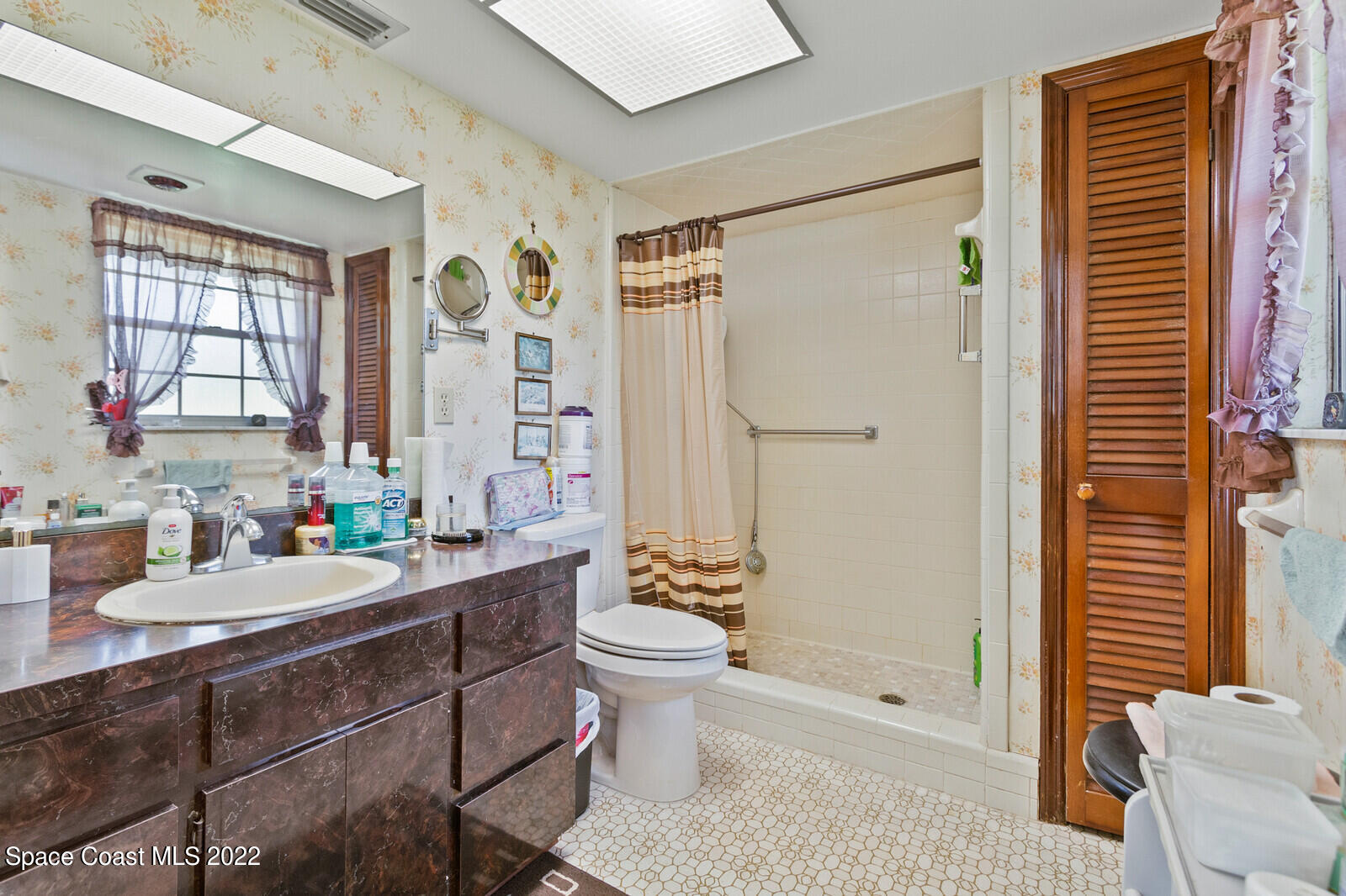 200 Atz Road Malabar, FL 32950 - Photo 26 of 30 a bathroom with a sink a toilet and shower