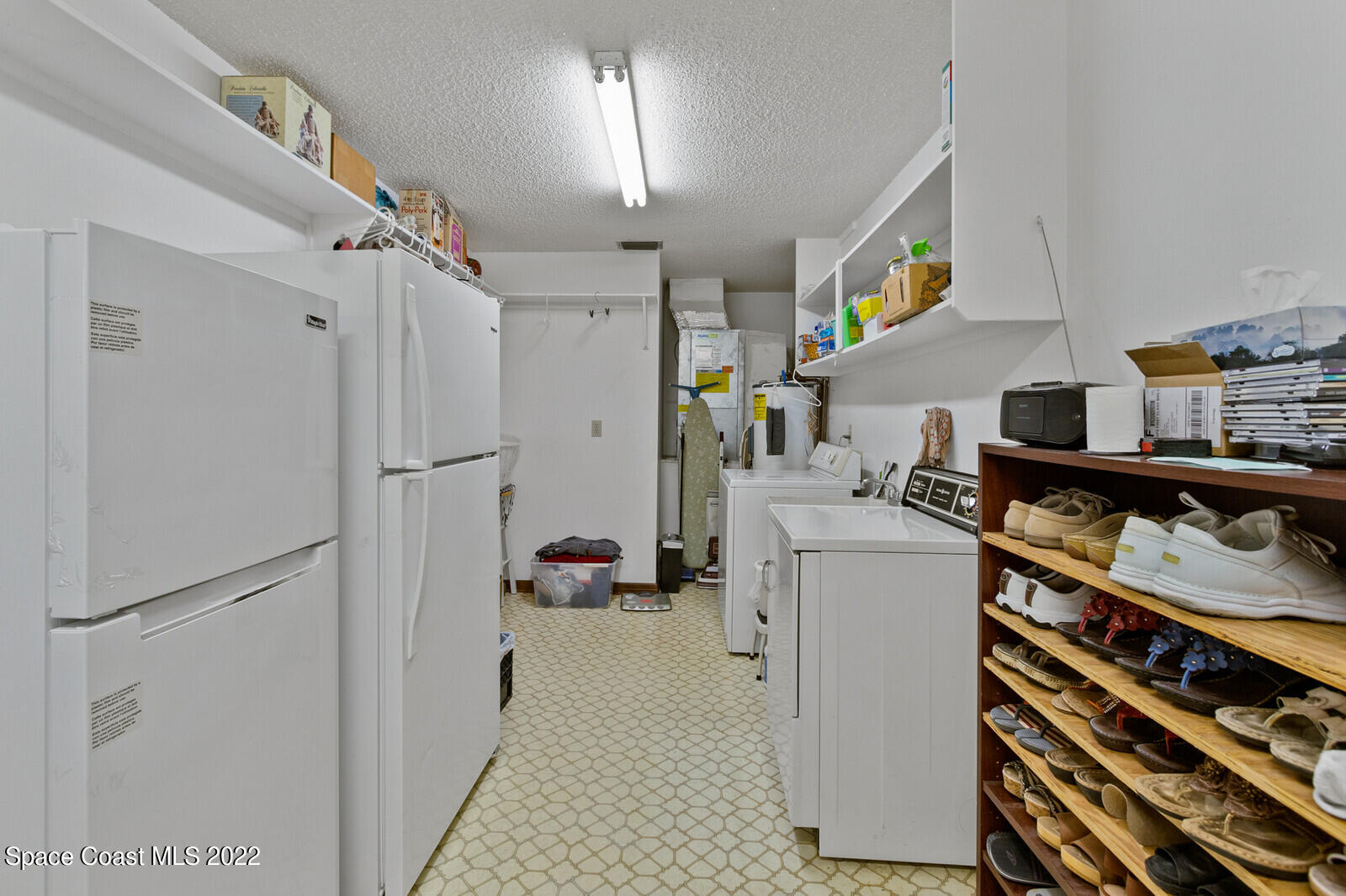 200 Atz Road Malabar, FL 32950 - Photo 29 of 30 a kitchen with a refrigerator and a stove
