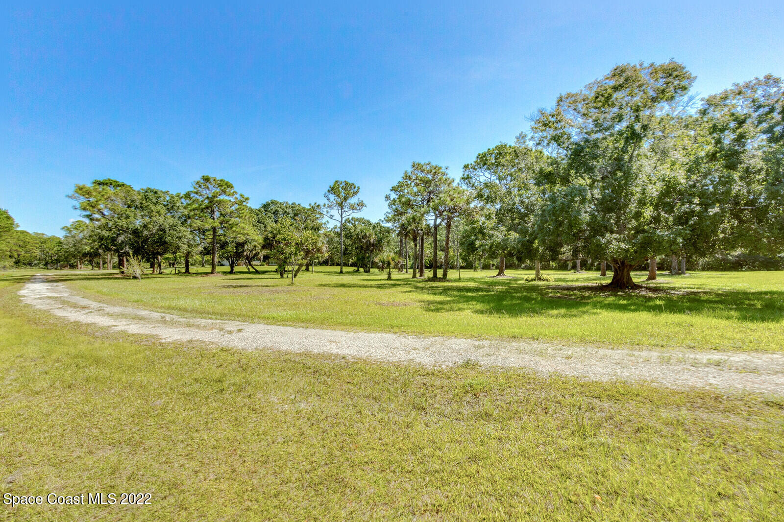 200 Atz Road Malabar, FL 32950 - Photo 8 of 30 a view of a swimming pool with a yard