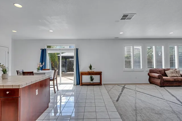 a kitchen with a stove sink and refrigerator