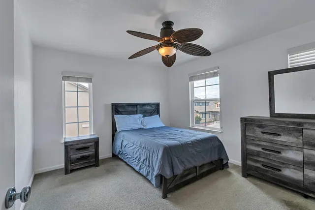 a bathroom with a double vanity sink mirror and shower