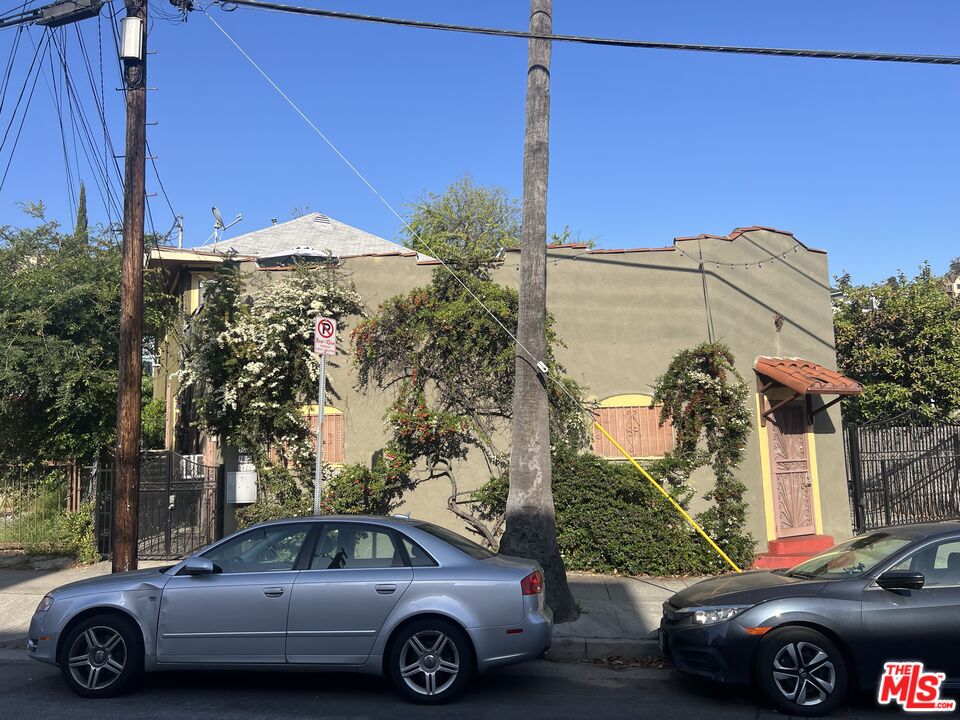 1626 Echo Park Avenue Los Angeles, CA 90026 - Photo 2 of 4 a car parked in front of a house