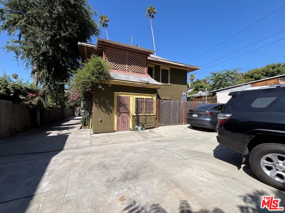 1626 Echo Park Avenue Los Angeles, CA 90026 - Photo 3 of 4 a front view of a house with a garden