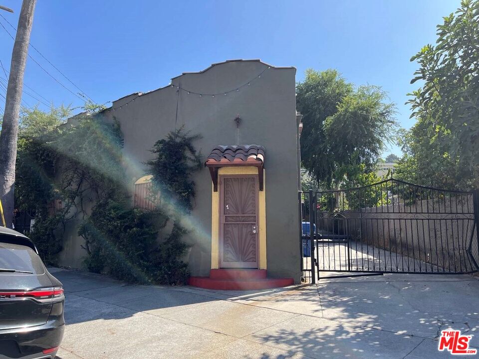 1626 Echo Park Avenue Los Angeles, CA 90026 - Photo 4 of 4 a car parked in front of a house
