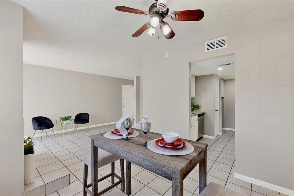 11311 Audelia Road, Unit 165 Dallas, TX 75243 - Photo 16 of 31 Dining space with a textured ceiling, ceiling fan, and light tile patterned floors