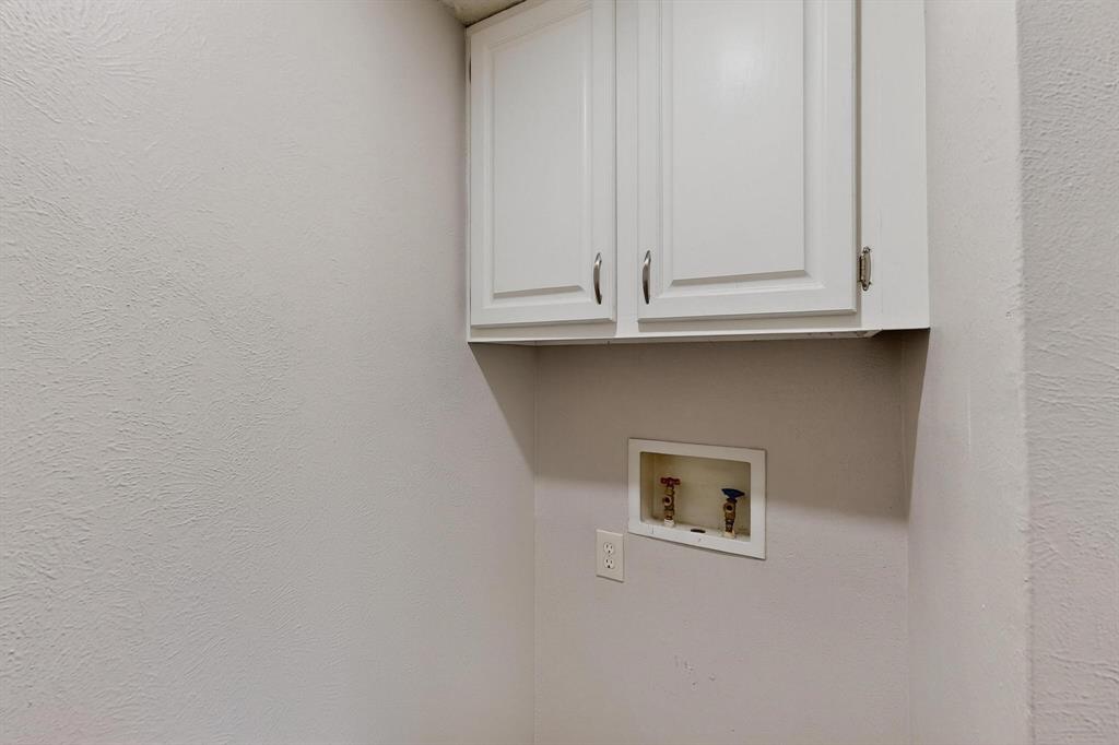 11311 Audelia Road, Unit 165 Dallas, TX 75243 - Photo 19 of 31 Laundry room with hookup for a washing machine, cabinet space, and a textured wall