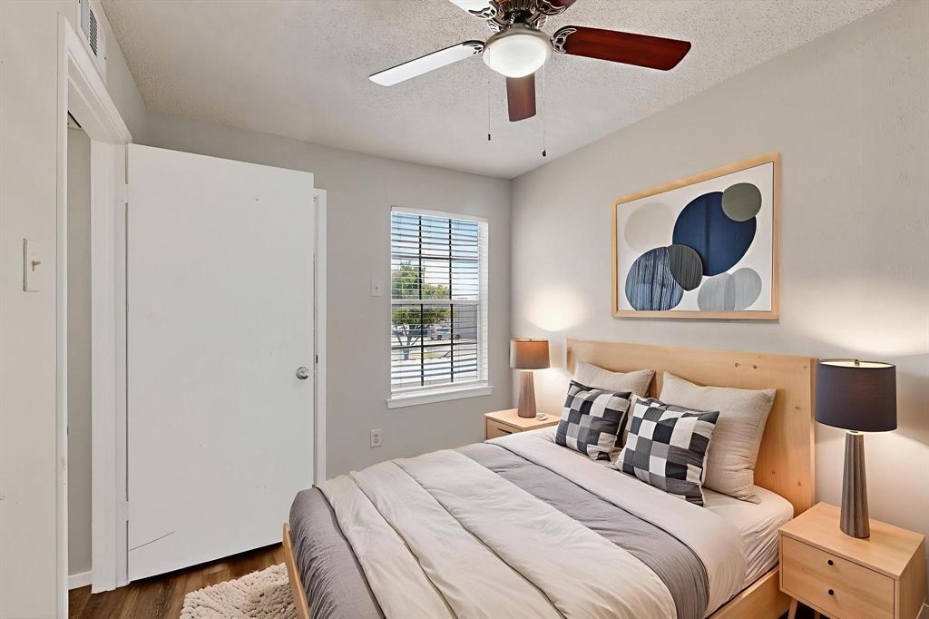 11311 Audelia Road, Unit 165 Dallas, TX 75243 - Photo 20 of 31 Bedroom with a textured ceiling, wood finished floors, and ceiling fan