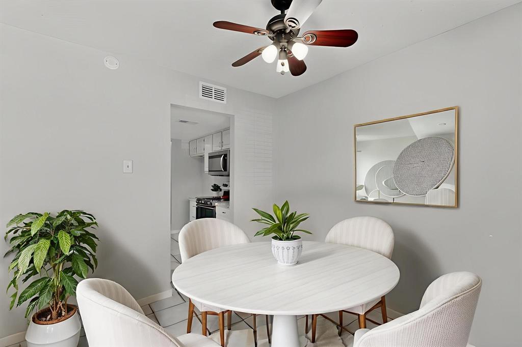 11311 Audelia Road, Unit 165 Dallas, TX 75243 - Photo 5 of 31 Dining area with ceiling fan and light tile patterned flooring