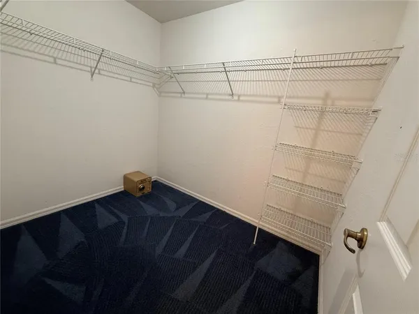 a view of a room with racks on the wall