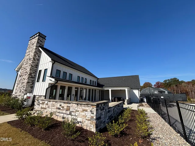 a view of house with yard and entertaining space
