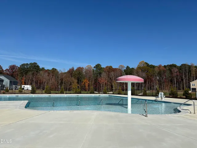 a swimming pool with outdoor seating