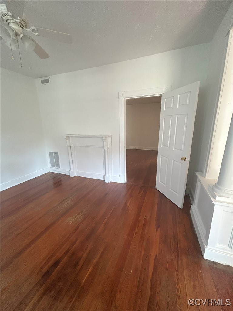 2307 Wright Avenue Richmond, VA 23224 - Photo 12 of 26 an empty room with wooden floor and windows
