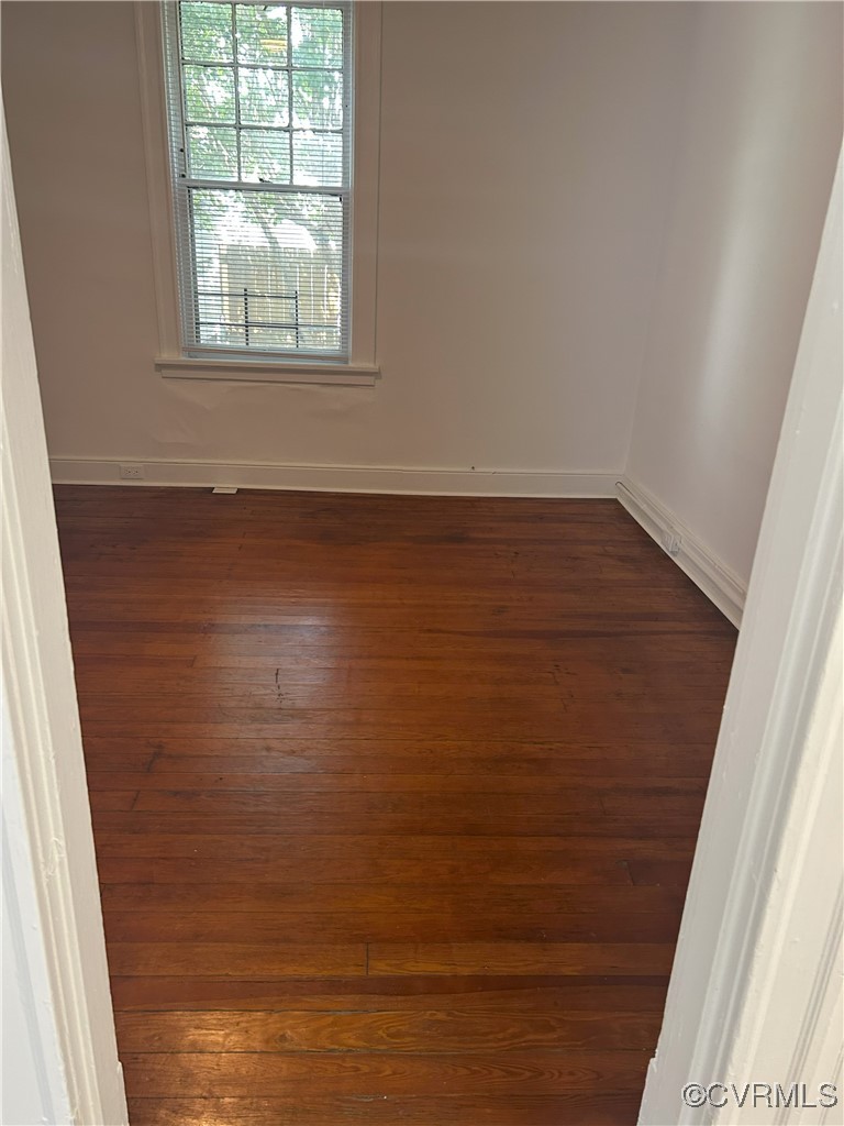 2307 Wright Avenue Richmond, VA 23224 - Photo 14 of 26 an empty room with wooden floor and windows