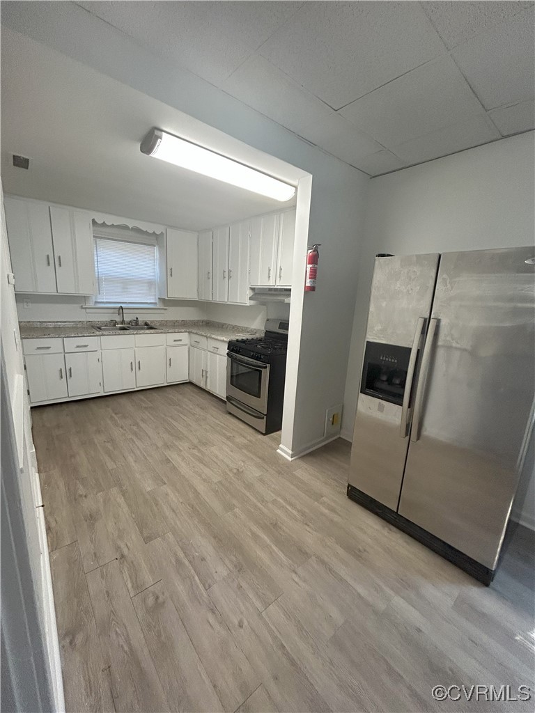 2307 Wright Avenue Richmond, VA 23224 - Photo 16 of 26 a kitchen with a refrigerator sink and stove