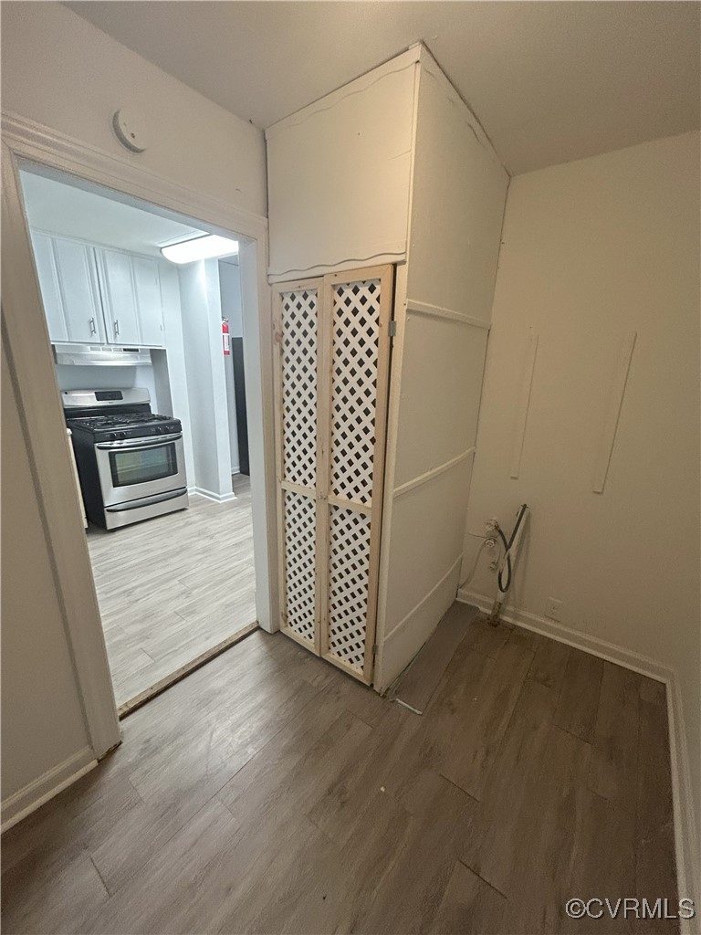 2307 Wright Avenue Richmond, VA 23224 - Photo 18 of 26 a view of a kitchen with wooden floor electronic appliances and cabinets