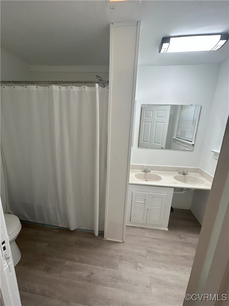 2307 Wright Avenue Richmond, VA 23224 - Photo 19 of 26 a view of bathroom with a sink and a toilet