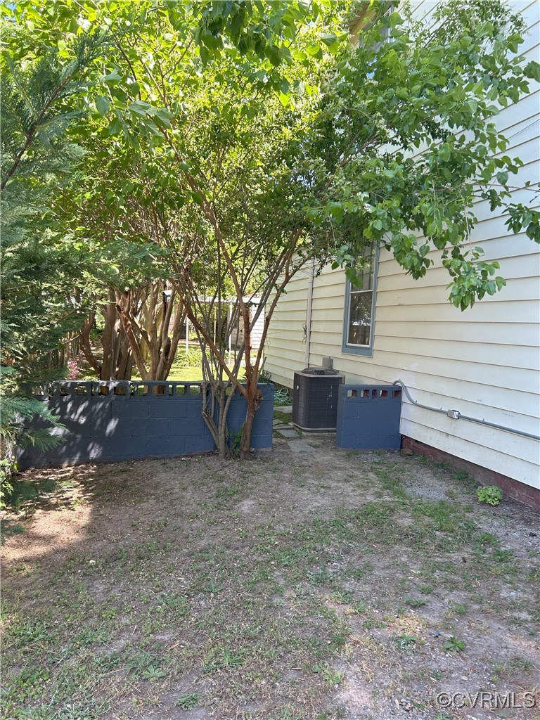 2307 Wright Avenue Richmond, VA 23224 - Photo 7 of 26 a view of a house with a yard and large tree