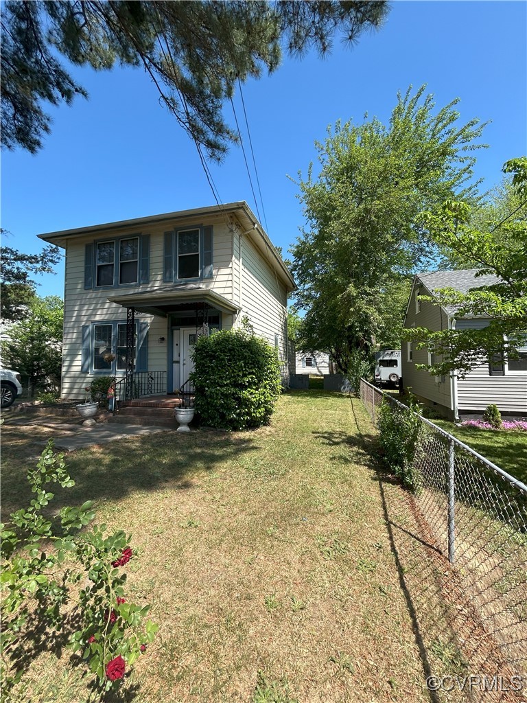 2307 Wright Avenue Richmond, VA 23224 - Photo 8 of 26 a front view of a house with a yard