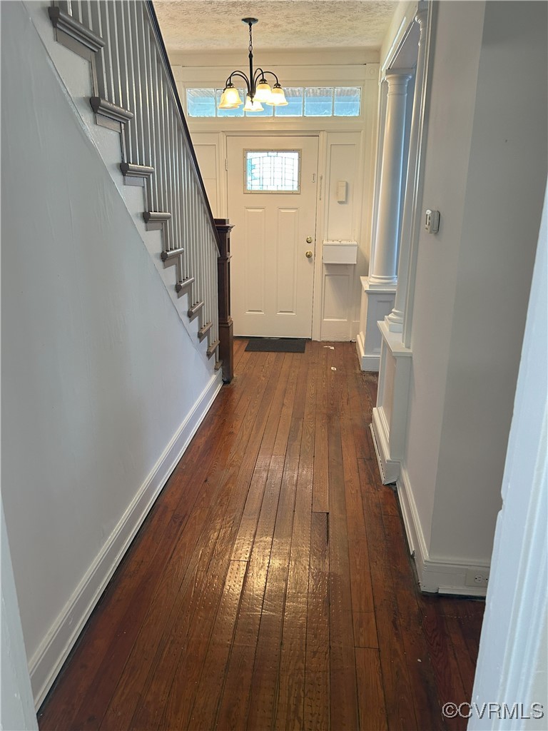 2307 Wright Avenue Richmond, VA 23224 - Photo 10 of 26 a view of a hallway with wooden floor and staircase