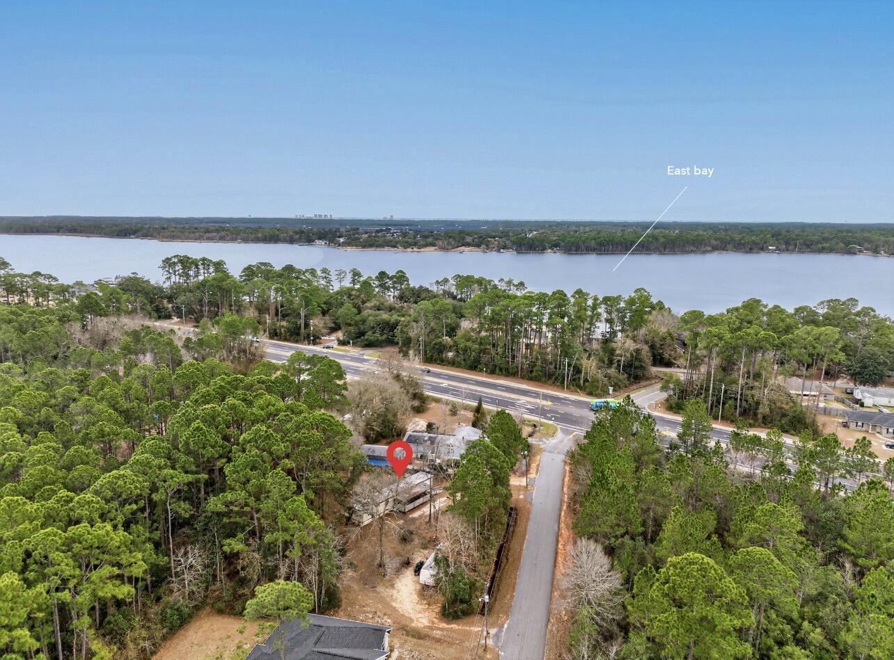 3116 Wells Beach Road Navarre, FL 32566 - Photo 2 of 6 a view of a lake with a mountain in the background