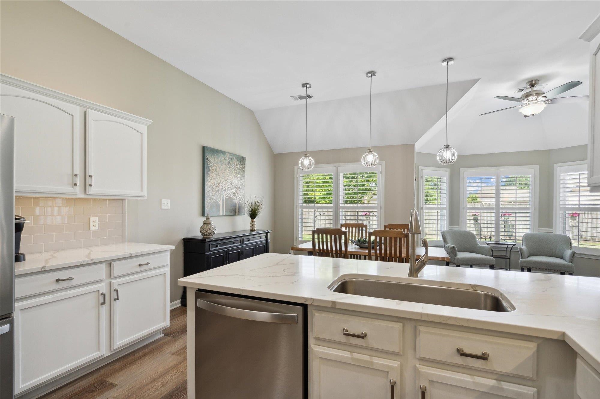 448 Queens Bridge Road Collierville, TN 38017 - Photo 14 of 32 a kitchen with a sink stove and cabinets