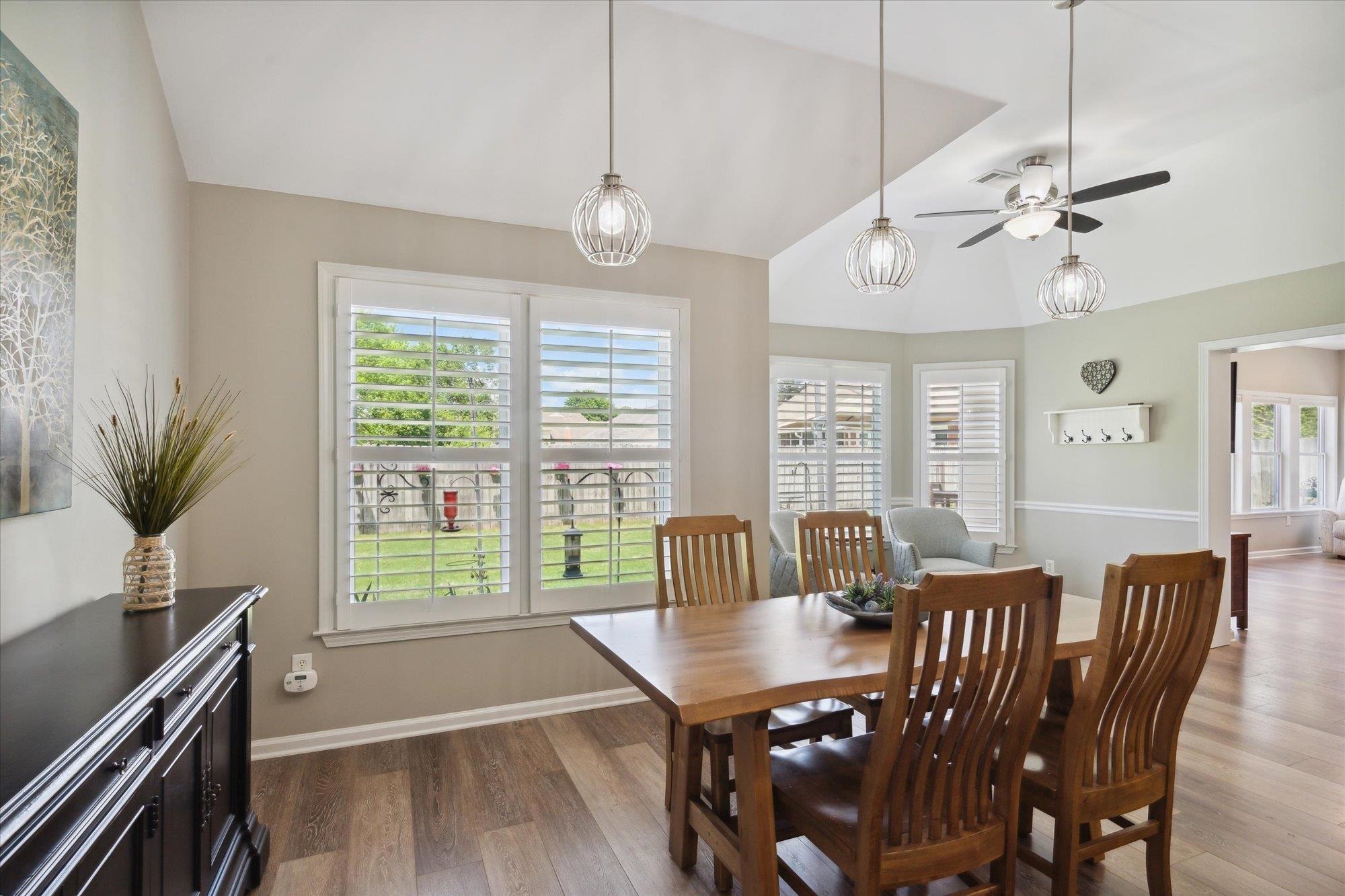 448 Queens Bridge Road Collierville, TN 38017 - Photo 15 of 32 a view of a dining room with furniture window and wooden floor