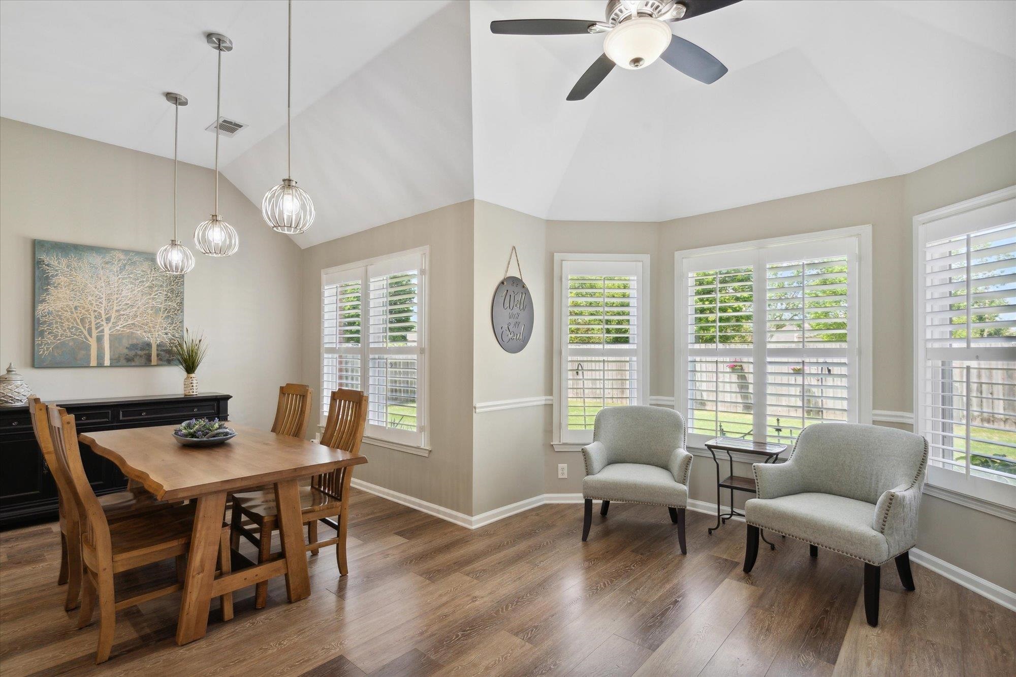 448 Queens Bridge Road Collierville, TN 38017 - Photo 16 of 32 a dining room with furniture a chandelier and wooden floor