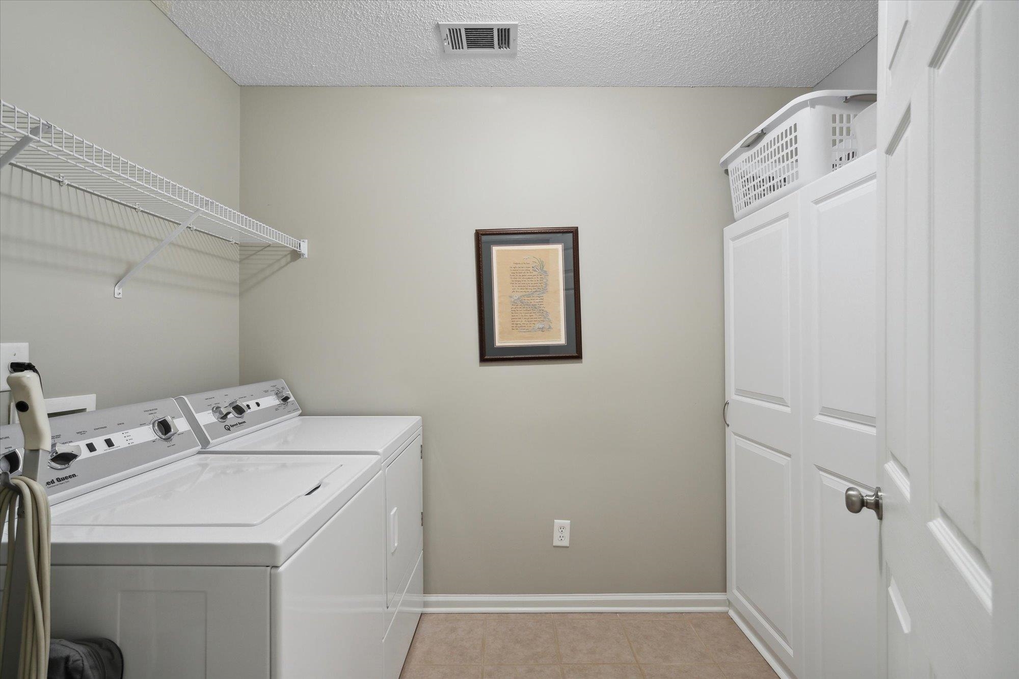 448 Queens Bridge Road Collierville, TN 38017 - Photo 20 of 32 a utility room with dryer and washer