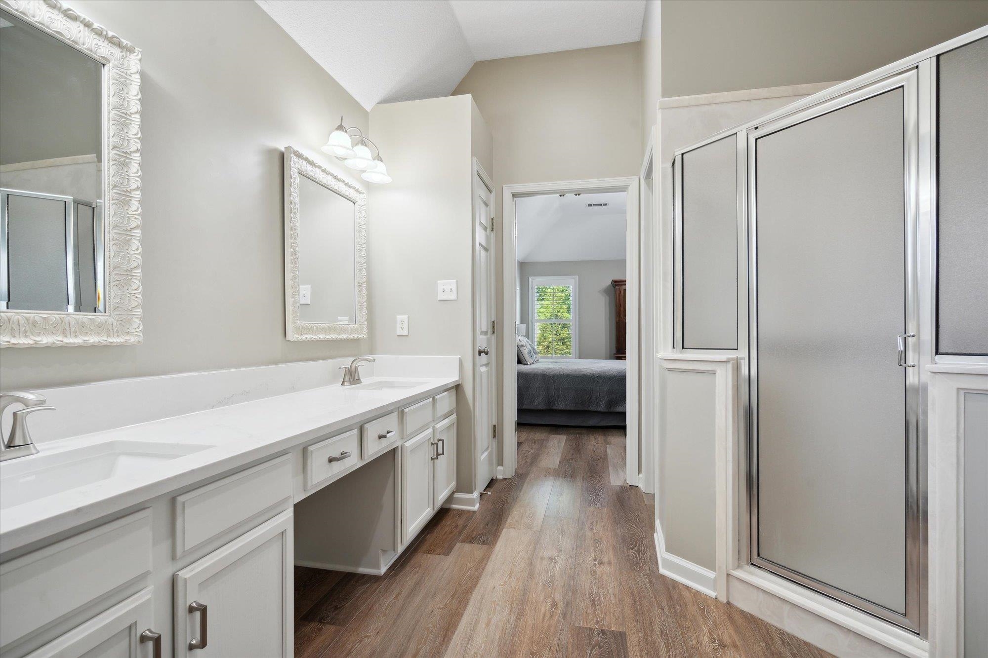 448 Queens Bridge Road Collierville, TN 38017 - Photo 23 of 32 a spacious bathroom with a shower a sink and a mirror