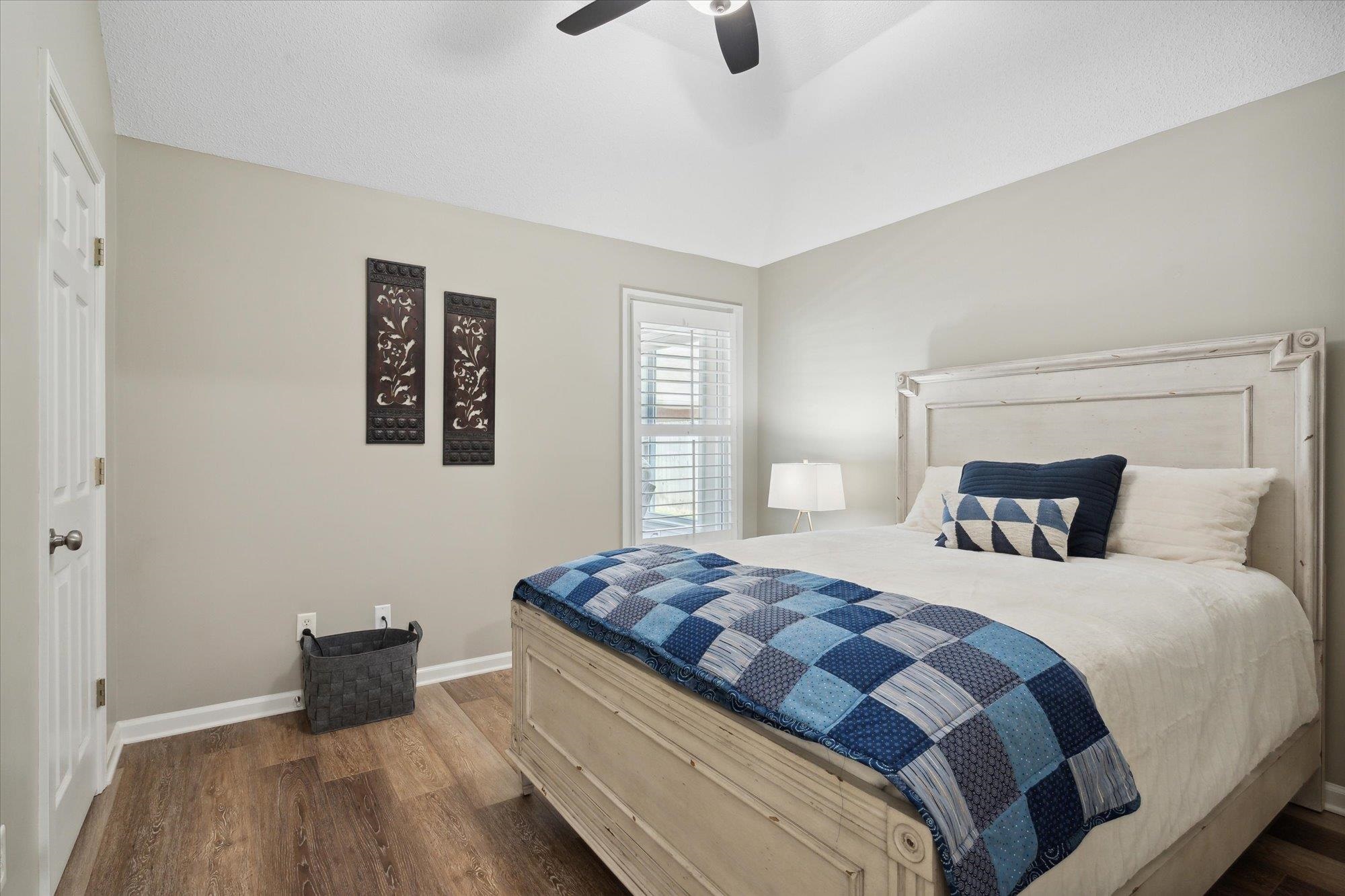 448 Queens Bridge Road Collierville, TN 38017 - Photo 27 of 32 a bedroom with a bed and wooden floor