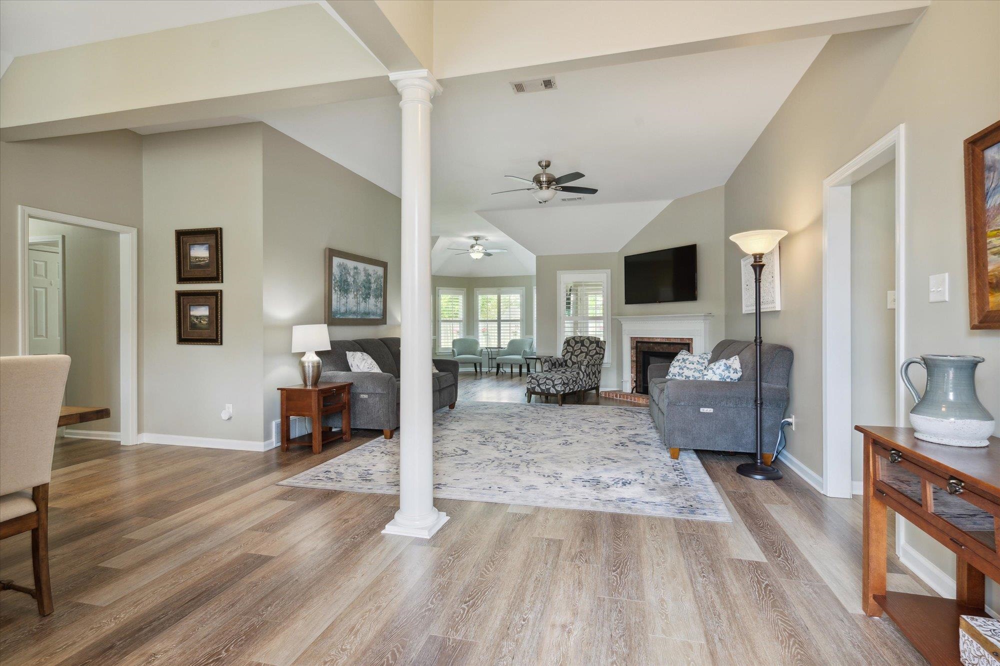 448 Queens Bridge Road Collierville, TN 38017 - Photo 3 of 32 a view of living room filled with furniture and wooden floor