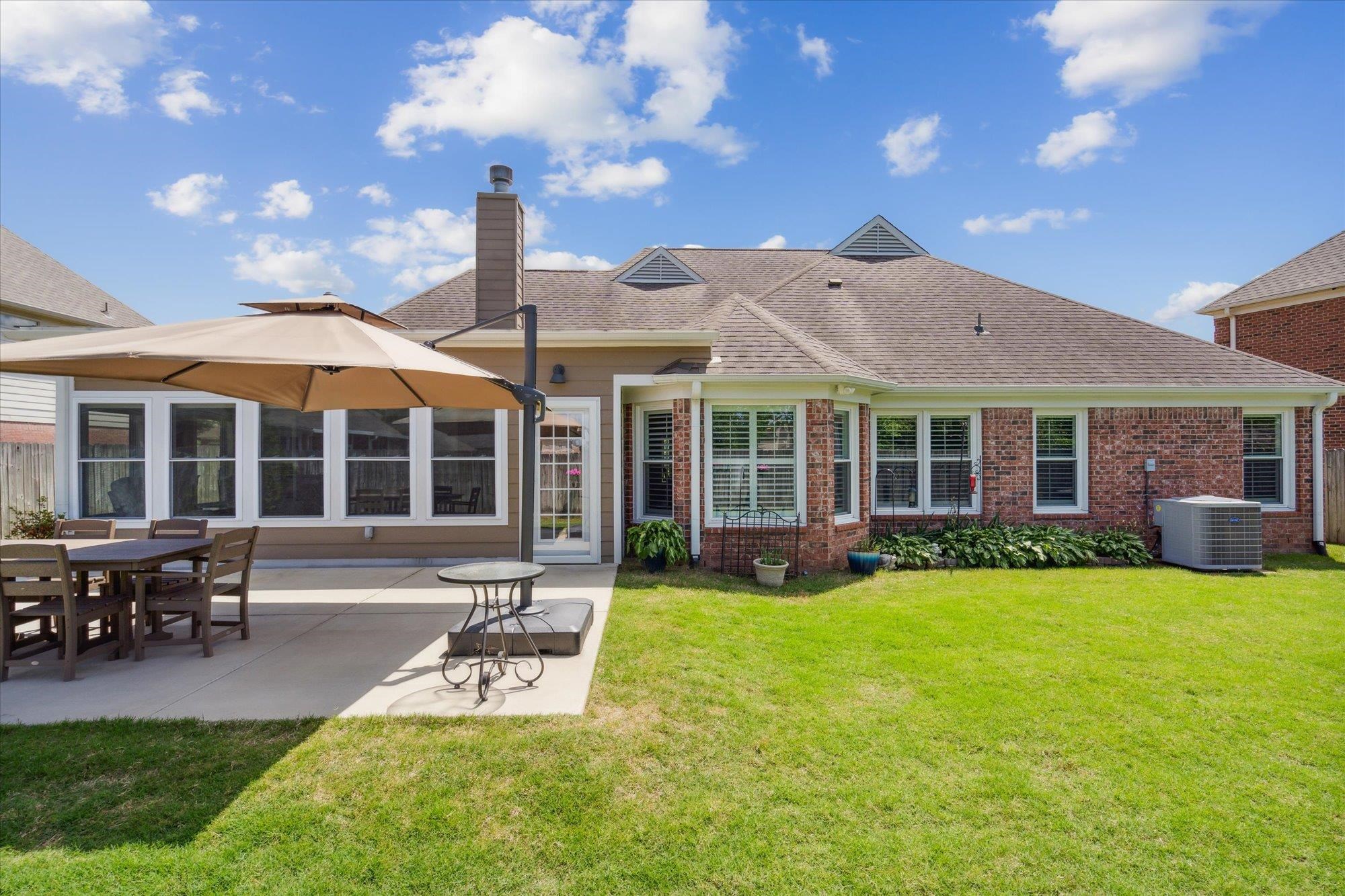 448 Queens Bridge Road Collierville, TN 38017 - Photo 31 of 32 a view of a house with a yard and sitting area
