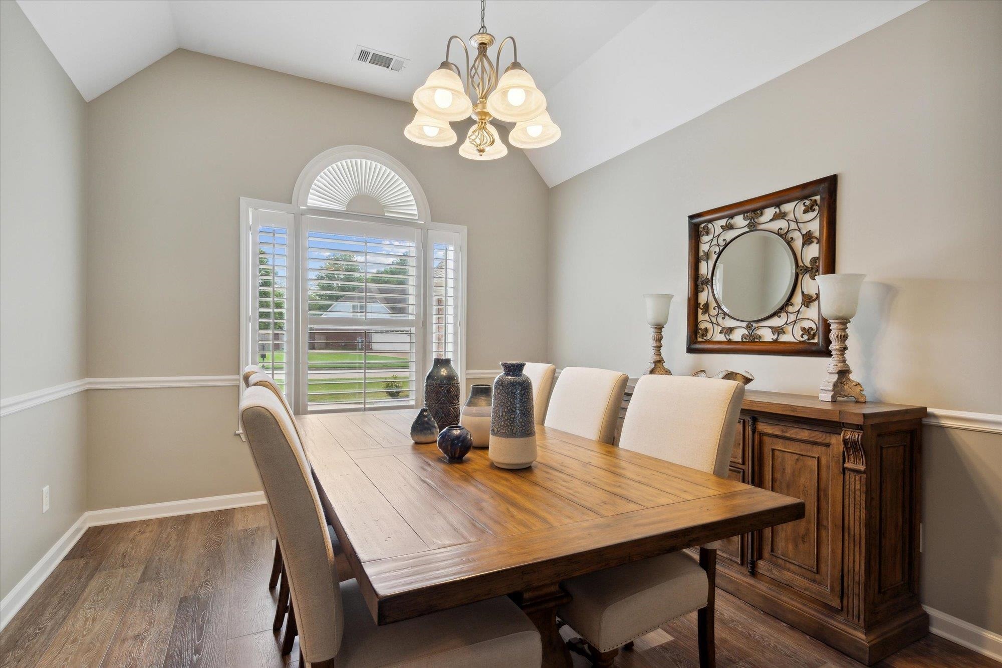 448 Queens Bridge Road Collierville, TN 38017 - Photo 5 of 32 a view of a dining room with furniture window and wooden floor