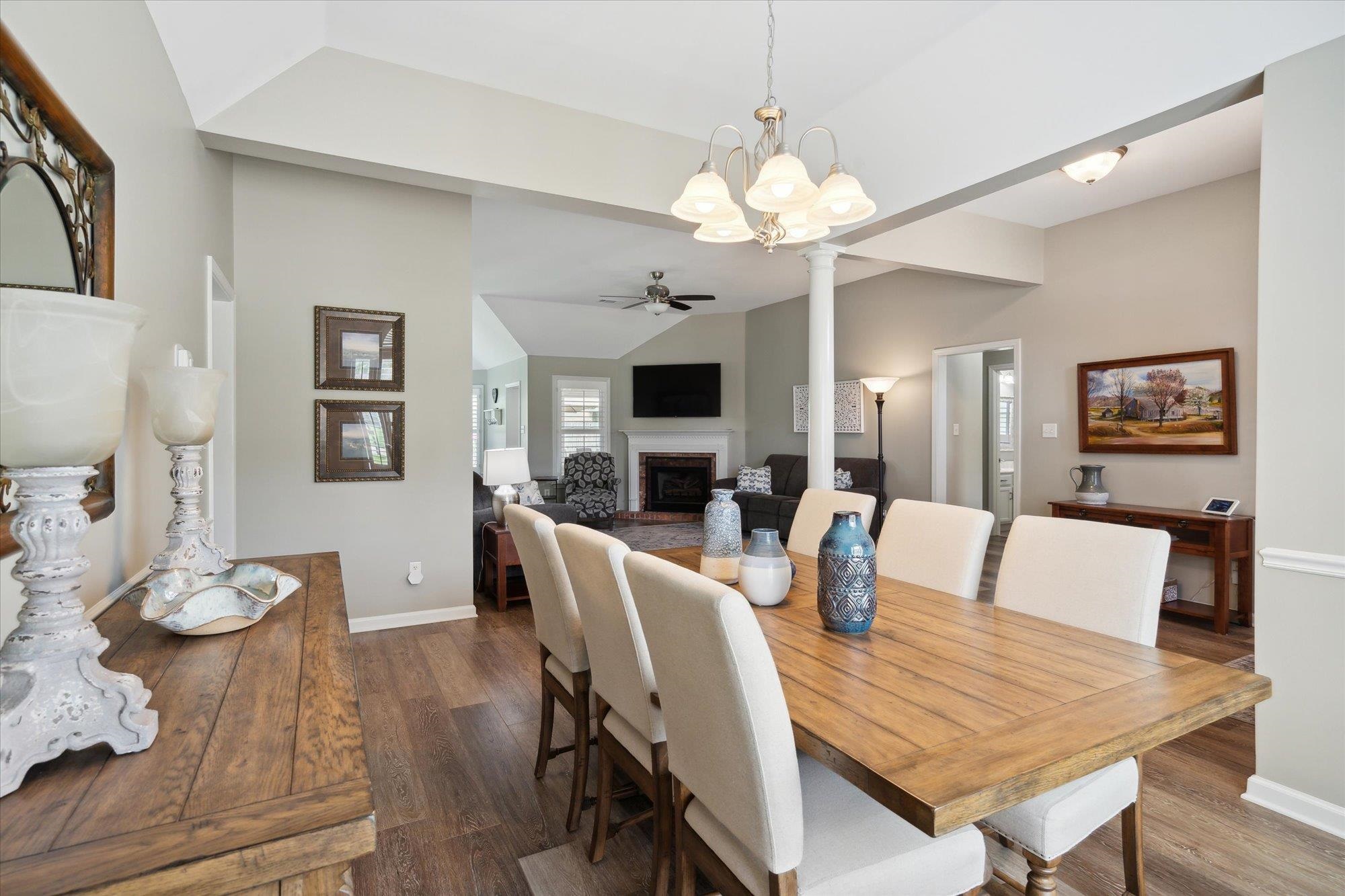 448 Queens Bridge Road Collierville, TN 38017 - Photo 6 of 32 a view of a dining room with furniture a chandelier and wooden floor