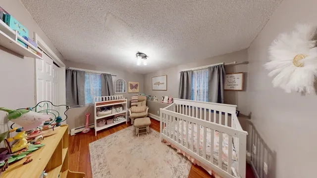 a bedroom with furniture and a window