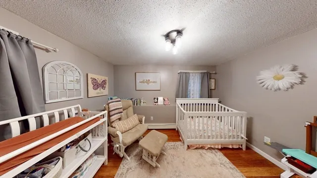 a bedroom with furniture and a window