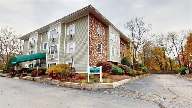 a view of a car park in front of a house