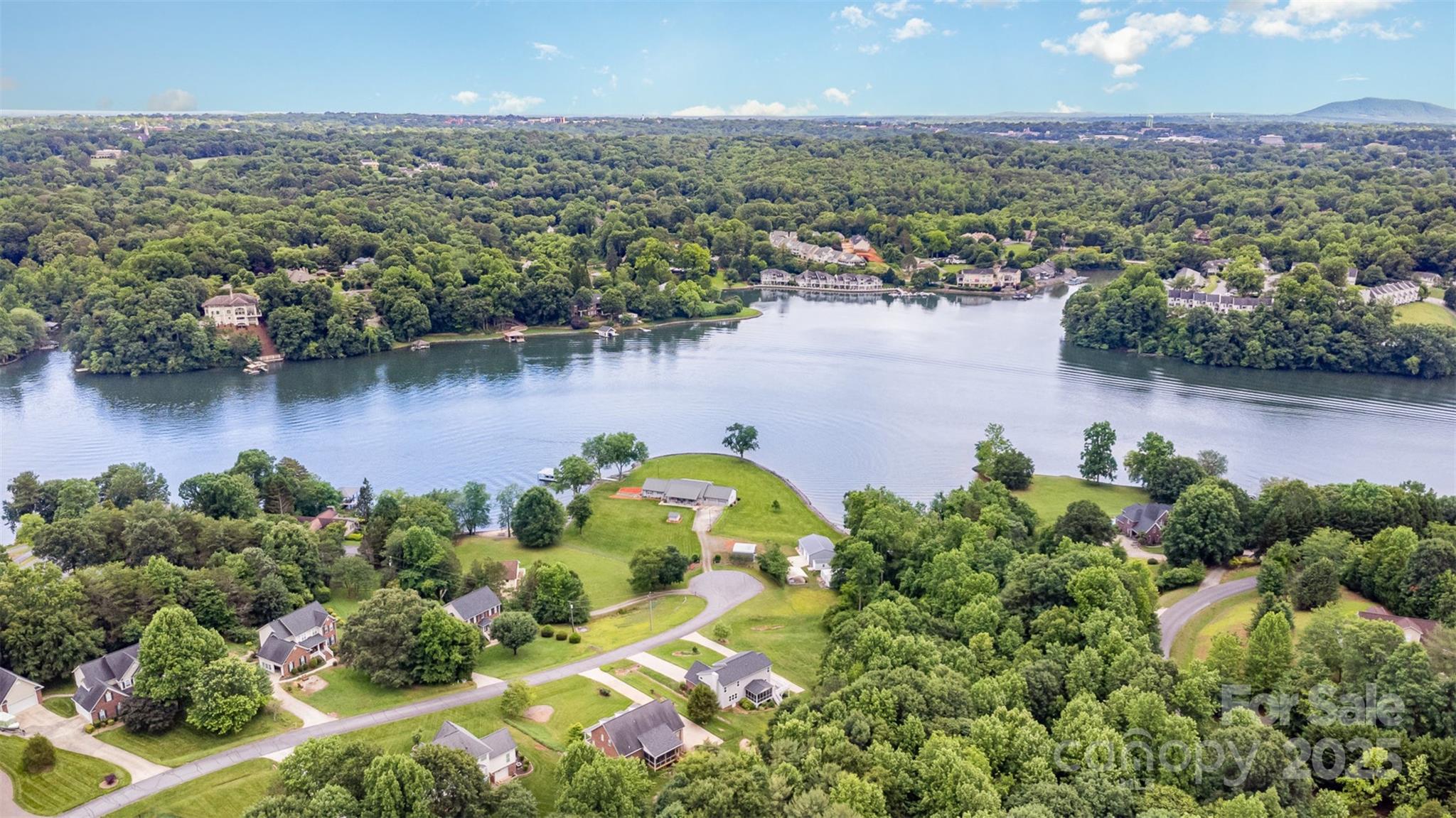 6255 Mountainside Drive Hickory, NC 28601 - Photo 2 of 8 an aerial view of a houses with a lake view
