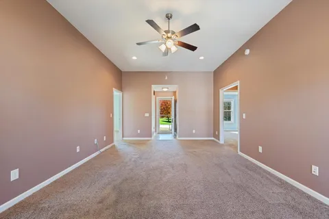 a kitchen with stainless steel appliances granite countertop a refrigerator a sink a stove top oven and a dishwasher