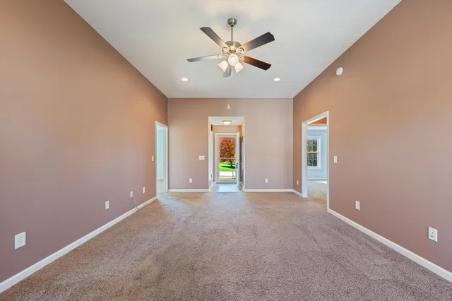 a kitchen with stainless steel appliances granite countertop a refrigerator a sink a stove top oven and a dishwasher