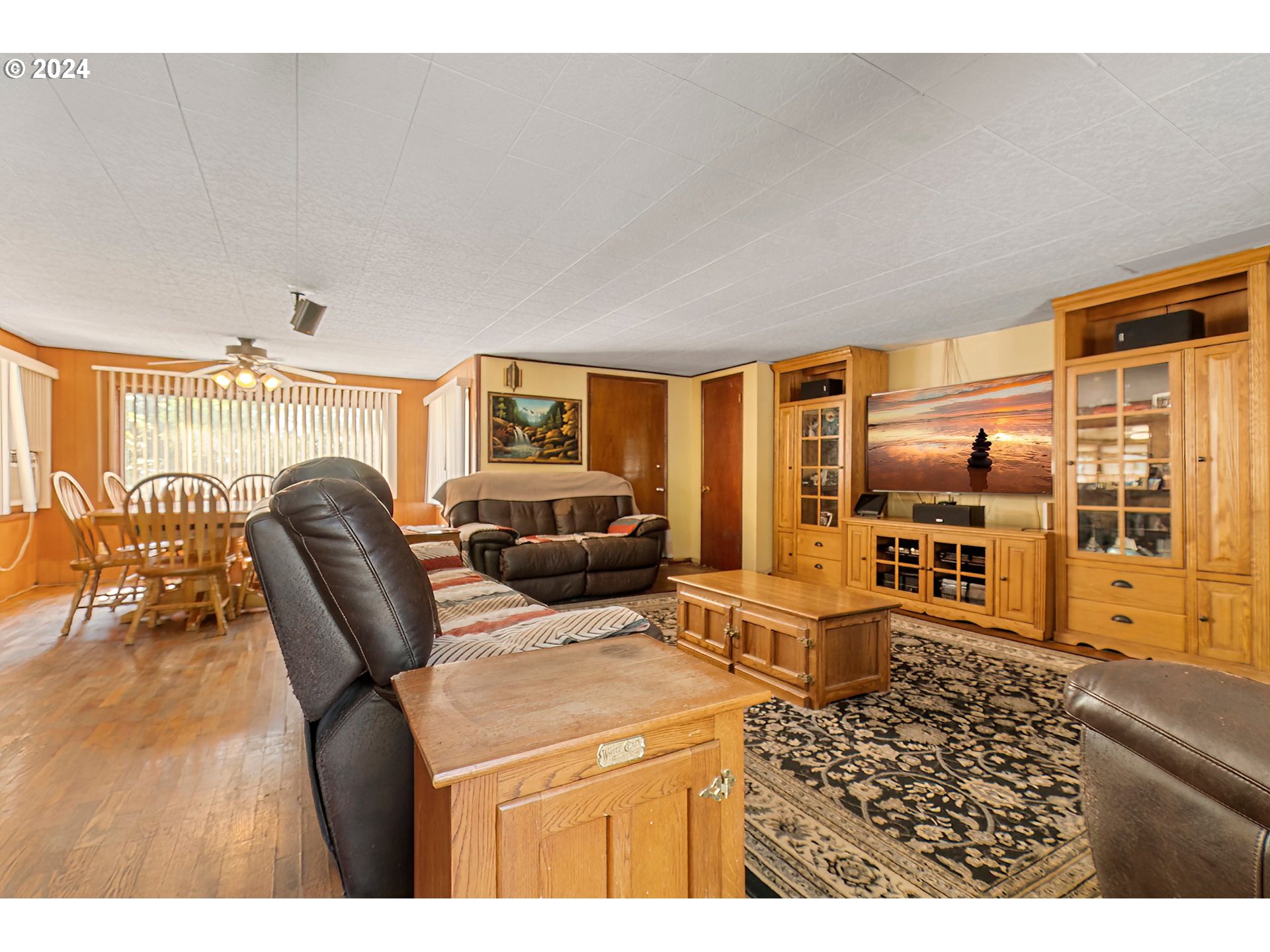 475 Frank Johns Road Stevenson, WA 98648 - Photo 8 of 17 a living room with furniture a large window and wooden floor