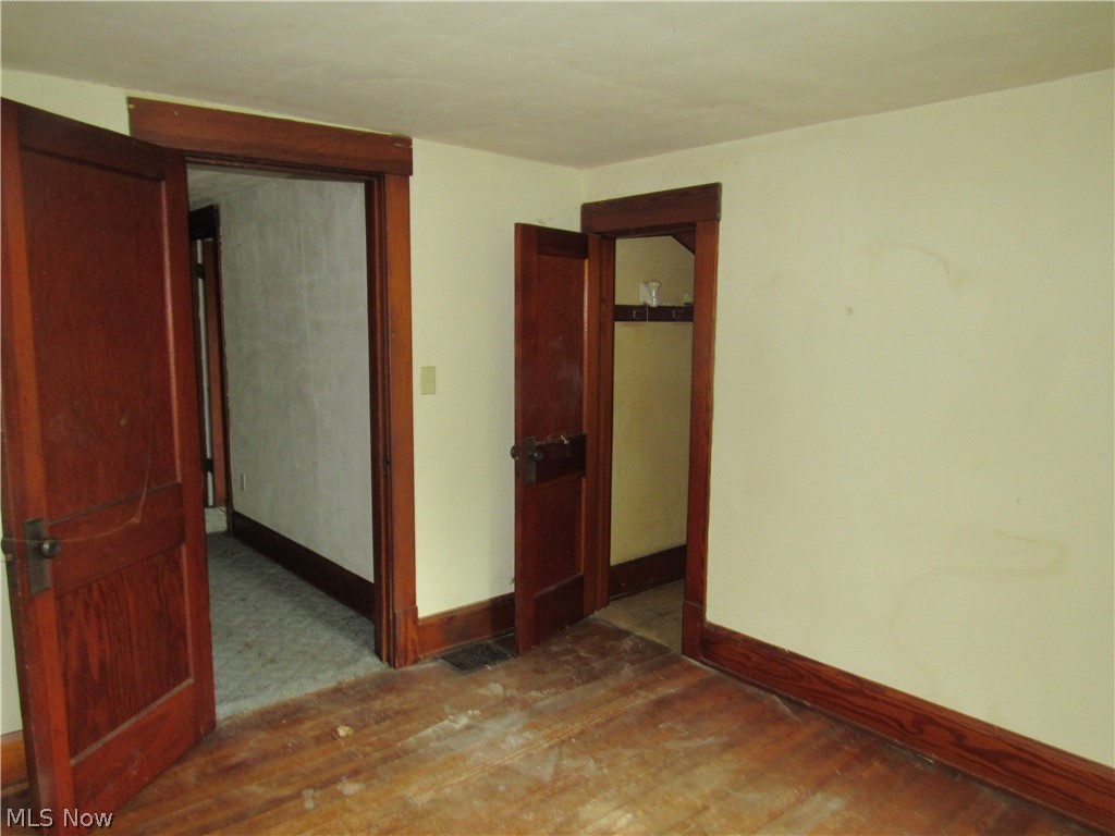 3462 Niles Carver Road Mineral Ridge, OH 44440 - Photo 17 of 33 Unfurnished bedroom featuring dark hardwood / wood-style floors