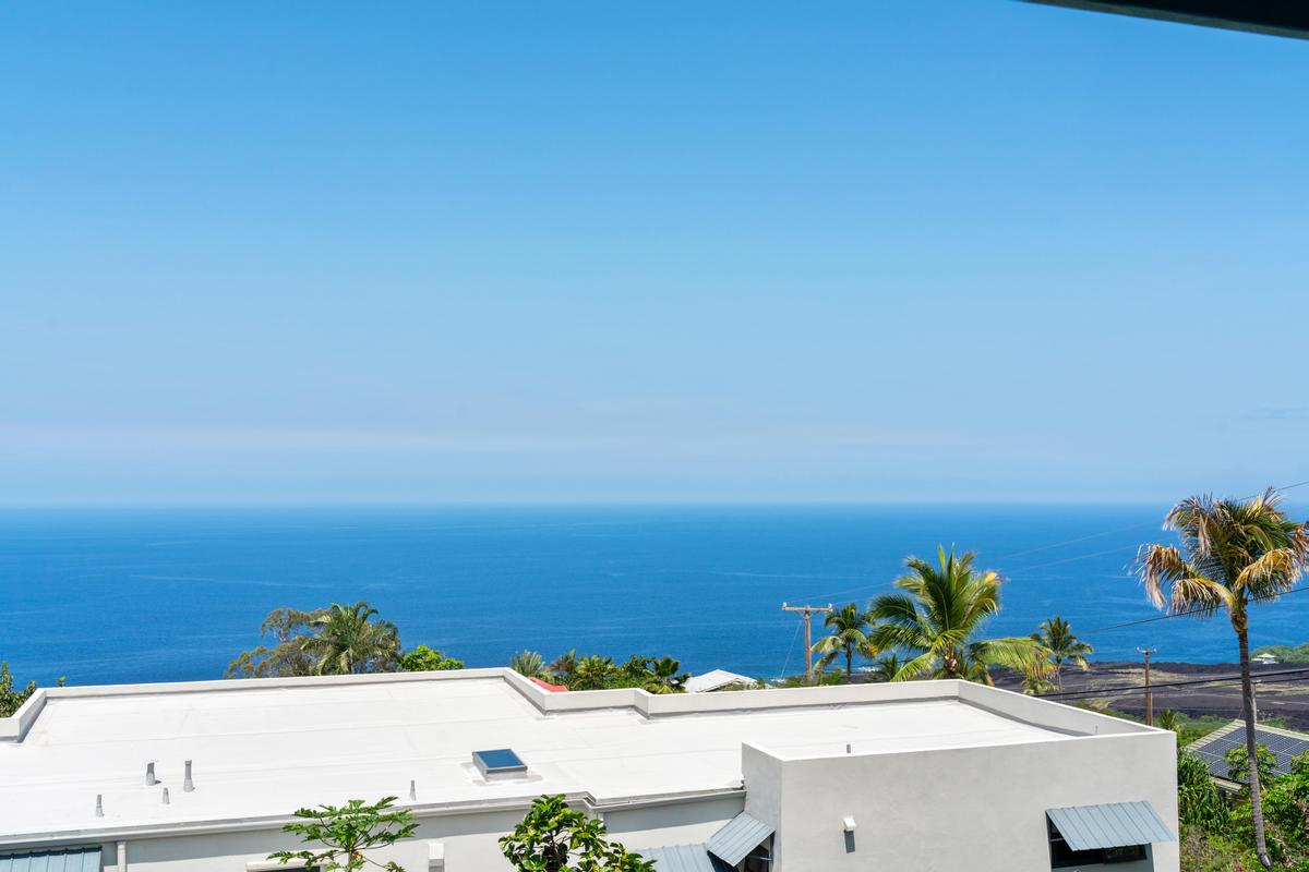 87-404 Kaohe Road Captain Cook, HI 96704 - Photo 11 of 25 a view of a swimming pool with an ocean view